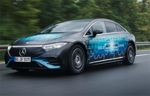 A Mercedes-Benz electric vehicle on the road, wrapped with 'SOLID STATE' branding, testing solid-state battery technology