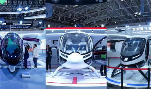 Three eVTOL flying car prototypes on display at an exhibition, representing the next-gen aircraft that will benefit from solid-state batteries.