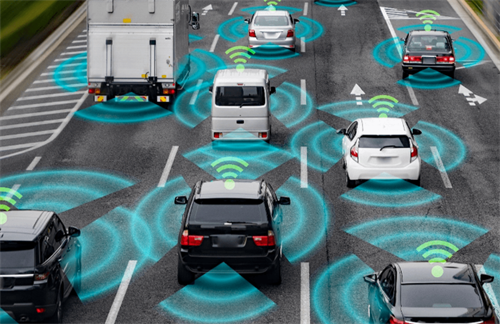 Multiple cars on a highway with sensor and V2X communication overlays, showing the 'God’s-eye view' enabled by connected technology.